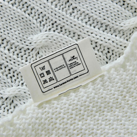 Plaid Karaca Home en maille torsadée certifié Oeko-Tex, blanc cassé